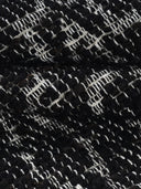 close up of black handwoven rug