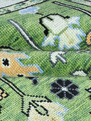 green hand knotted rug close up