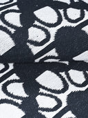 Close-up of flat woven black and white patterned rug