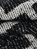 Close-up of black and white woven carpet
