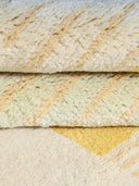 yellow pastel hand knotted wool rug close up