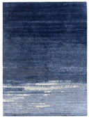 Blue textured hand knotted silk rug with a gradient pattern