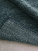 solid blue handloom wool rug close up